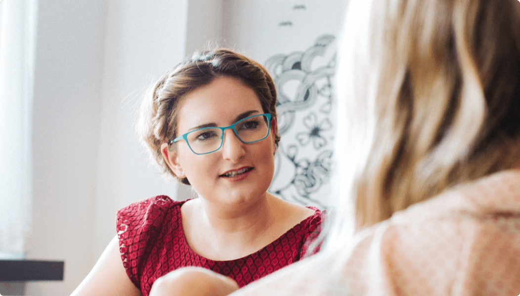 Image-of-a-woman-wearing-glasses-talking-with-another-woman-during-a-meeting